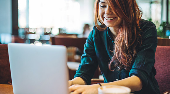 Woman typing on laptop