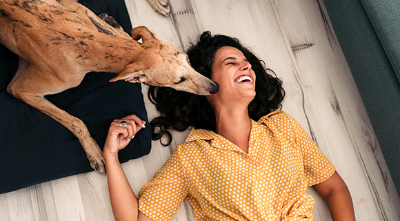 Dog and woman laughing